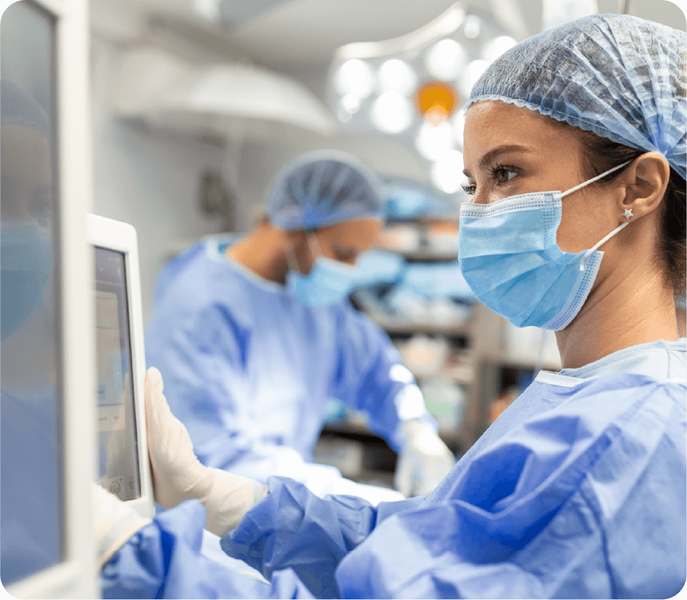 Surgeon inspecting medical machines